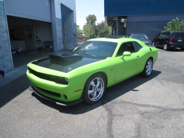 After repair of a green car, fully restored to original condition.