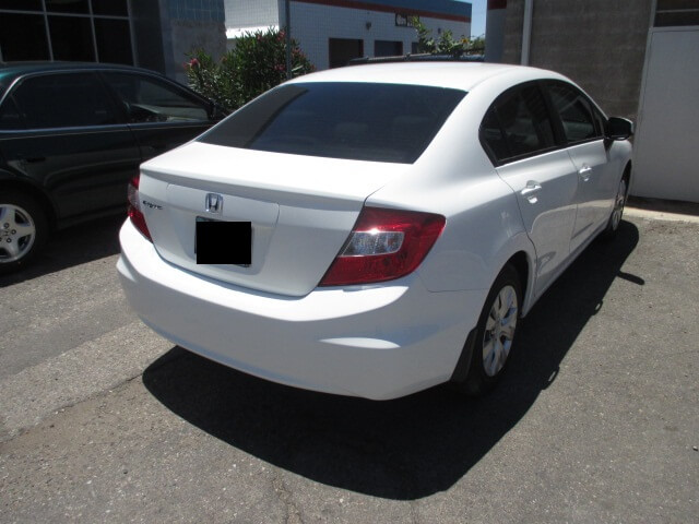 After repair of a white car, showing a flawless restoration.